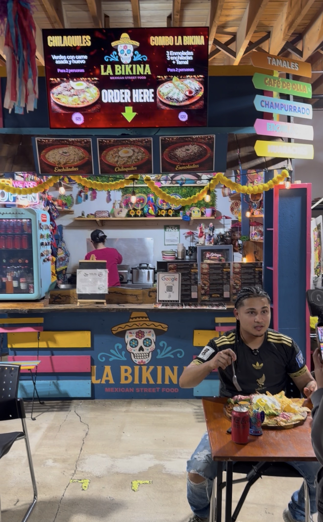 The colourful La Bikina food stand inside Kensington Market